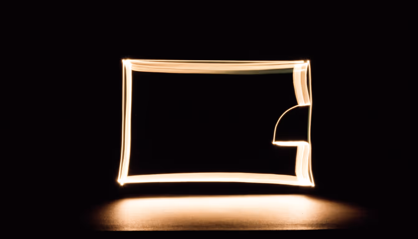 A room plan drawn in light: walls, and the arc of a door swing.
